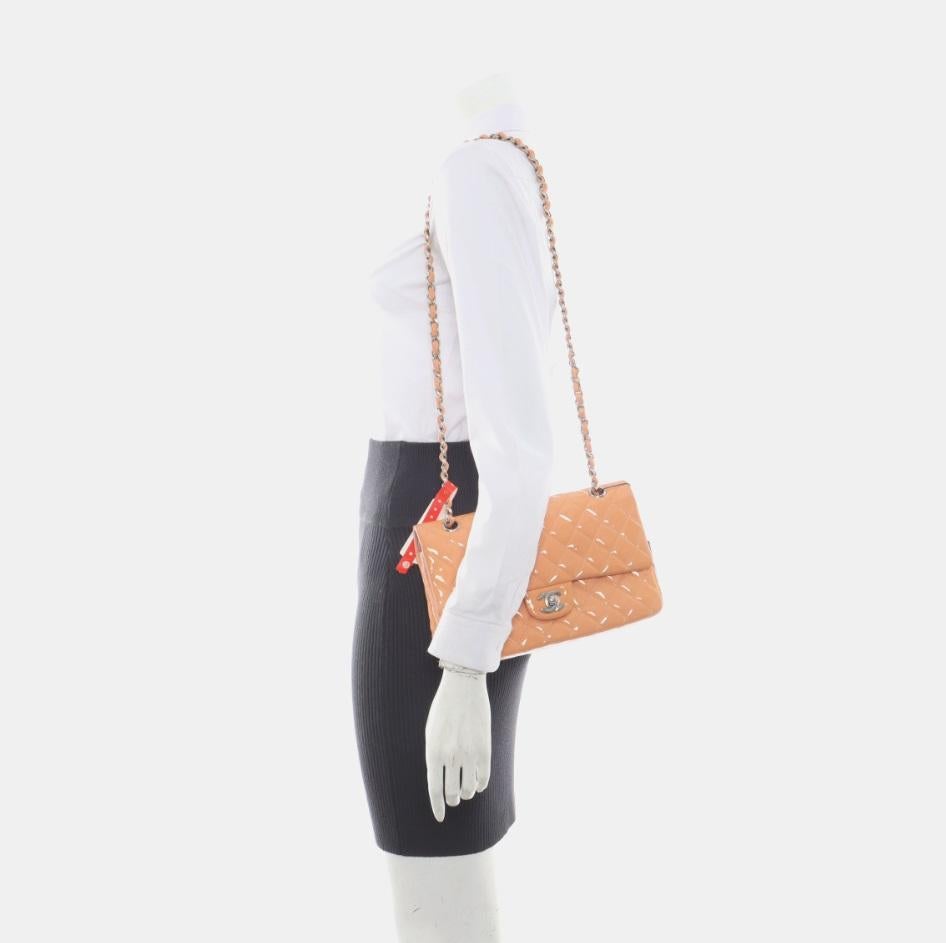 Chanel Classic Flap Medium Pink Orange Patent Leather Silver HW, 2012-2013
  These are professional photos of the actual bag offered by Luxbags.
  Add a touch of brightness to your summer wardrobe with this classic flap from Chanel, featuring a