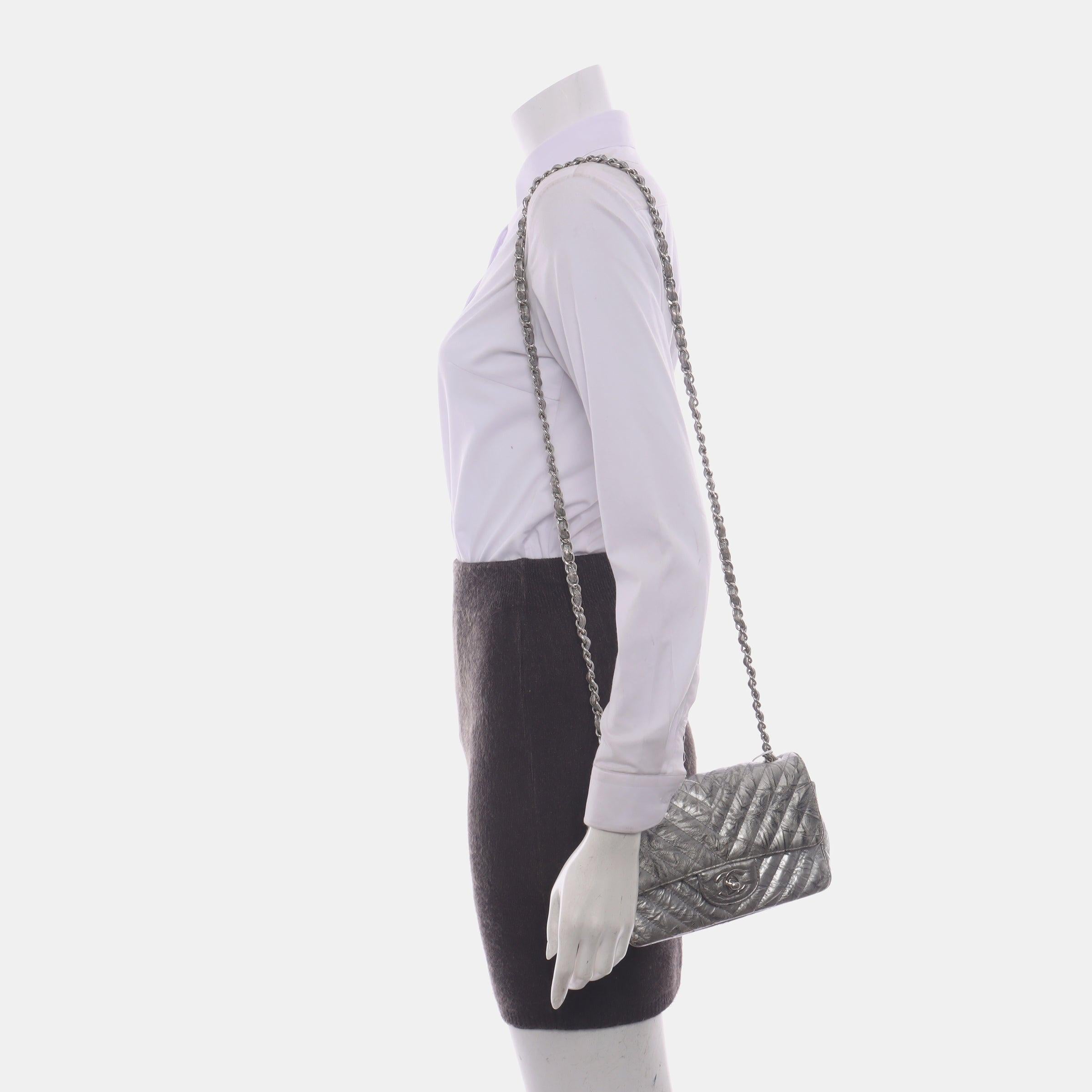 Chanel Classic Flap Mini Rectangular Patent Metallic Crumpled Calfskin Chevron Quilted Silver
 These are professional photos of the actual bag offered by Luxbags.
 Add a touch of brightness to your summer wardrobe with this classic flap from Chanel,