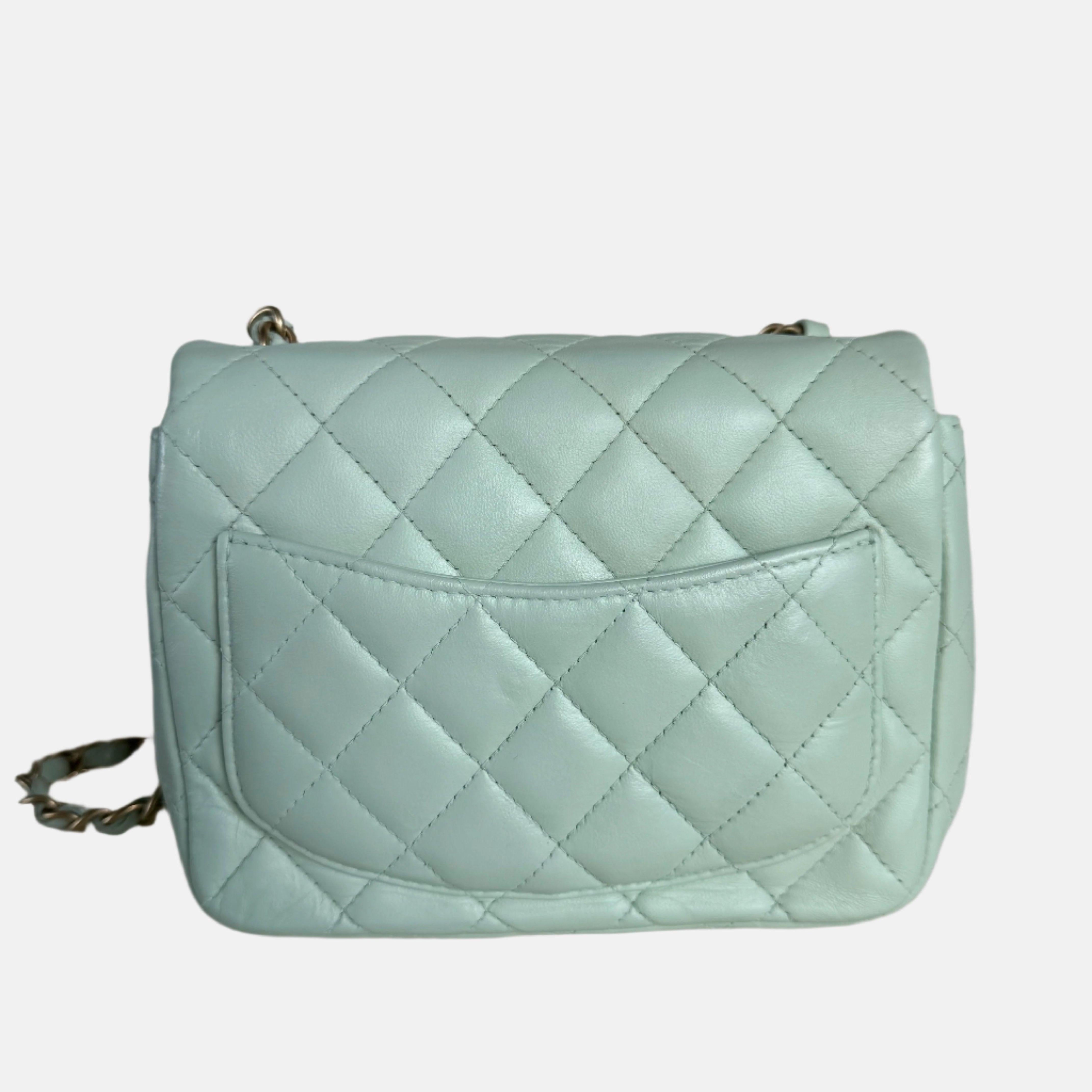 Chanel Classic Flap Mini Square Baby Mint Blue Lambskin Crossbody Bag, 2014
  These are professional photos of the actual bag offered by Luxbags.
  CONDITION: GOOD
  This previously owned and used item is in good condition with little some signs of