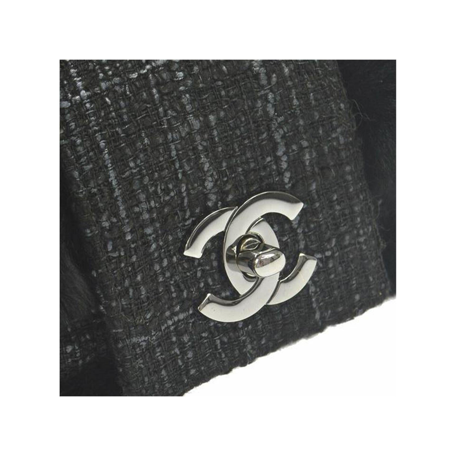 Chanel Rare Vintage Classic Flap Orylag Fur Grey Tweed 

2005 {VINTAGE 17 Years}
Silver hardware
Classic CC turn lock 
Black microfiber Chanel logo  interior lining
Center zippered pocket
9.8