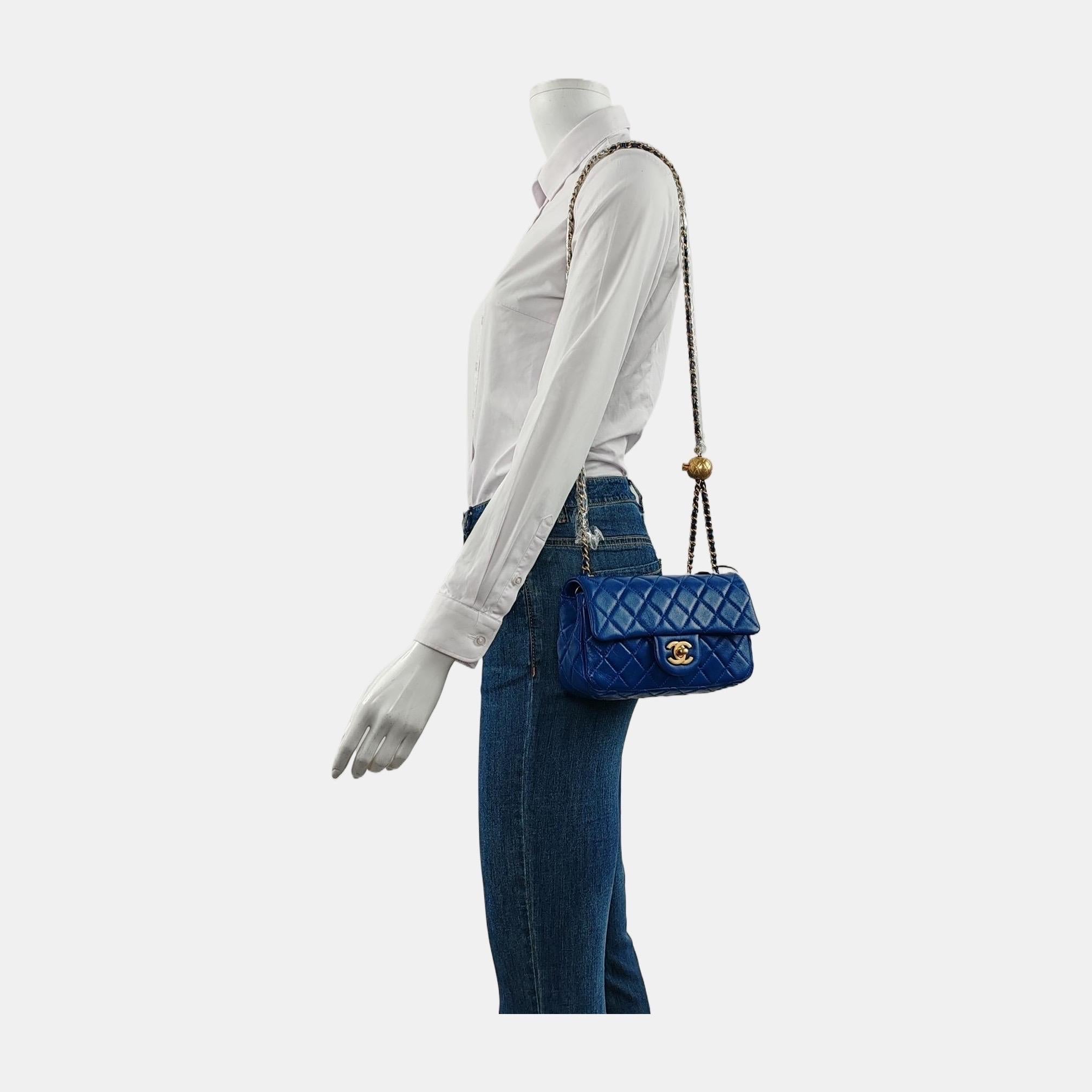 Add a touch of brightness to your summer wardrobe with this classic flap from Chanel, featuring a cheerful pastel with its misty blue leather.

CONDITION: MINT

This previously owned and used item is in mint condition with minimal signs of