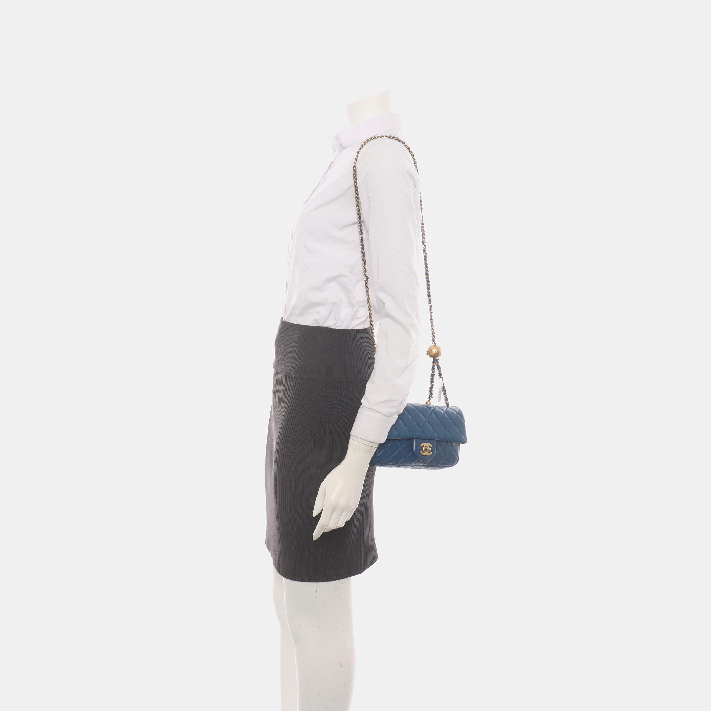 Add a touch of brightness to your summer wardrobe with this classic flap from Chanel, featuring a cheerful pastel with its misty blue leather.

CONDITION: MINT

This previously owned and used item is in mint condition with minimal signs of