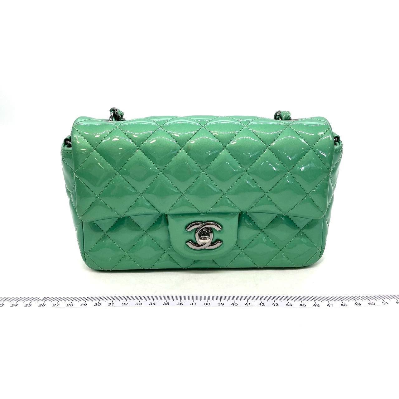 Chanel Classic Flap Rectangular Mini Green Patent Leather Silver HW
 These are professional photos of the actual bag offered by Luxbags.
 Add a touch of brightness to your summer wardrobe with this classic flap from Chanel, featuring a cheerful