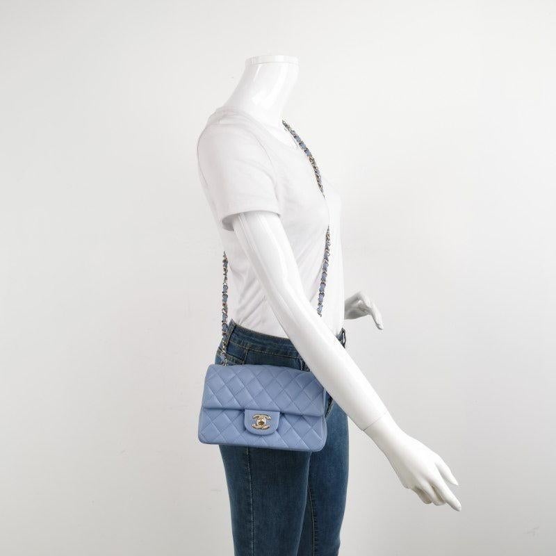 Chanel Classic Flap Rectangular Mini Pale Blue Lambskin, 2020-2021
  These are professional photos of the actual bag offered by Luxbags.
  Add a touch of brightness to your summer wardrobe with this classic flap from Chanel, featuring a cheerful