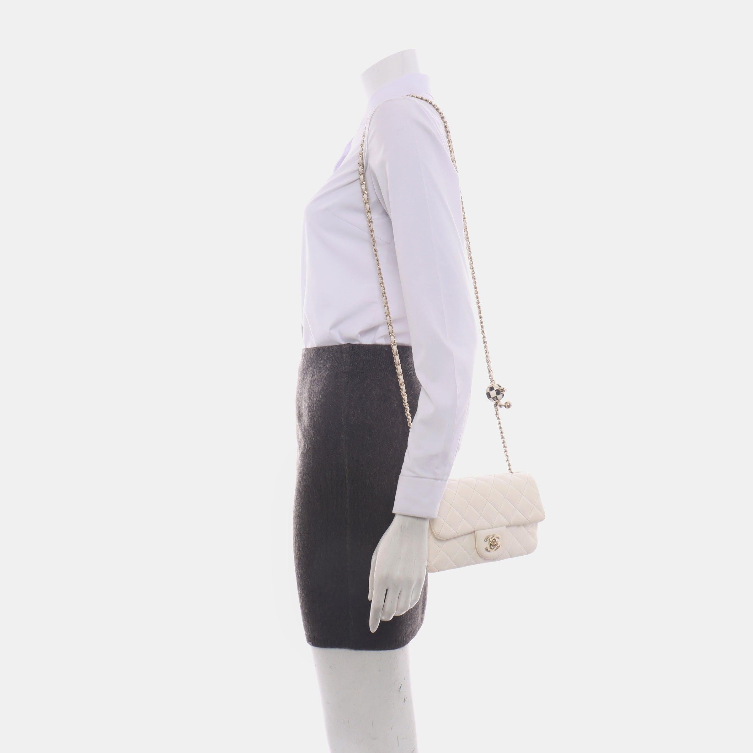 Chanel Classic Flap Rectangular Mini White Lambskin Pearl Crush Adjustable Gold Ball Chain
 These are professional photos of the actual bag offered by Luxbags.
 Add a touch of brightness to your summer wardrobe with this classic flap from Chanel,