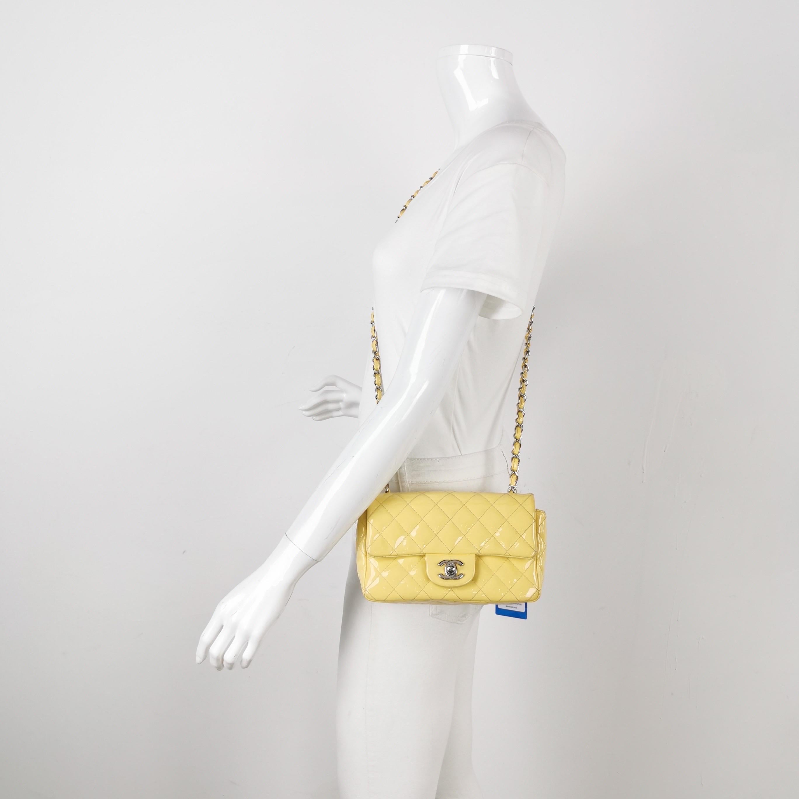 Add a touch of brightness to your summer wardrobe with this classic flap from Chanel, featuring a cheerful shine with its yellow patent leather.

CONDITION: VERY GOOD

This previously owned and used item is in good condition with some signs of use.