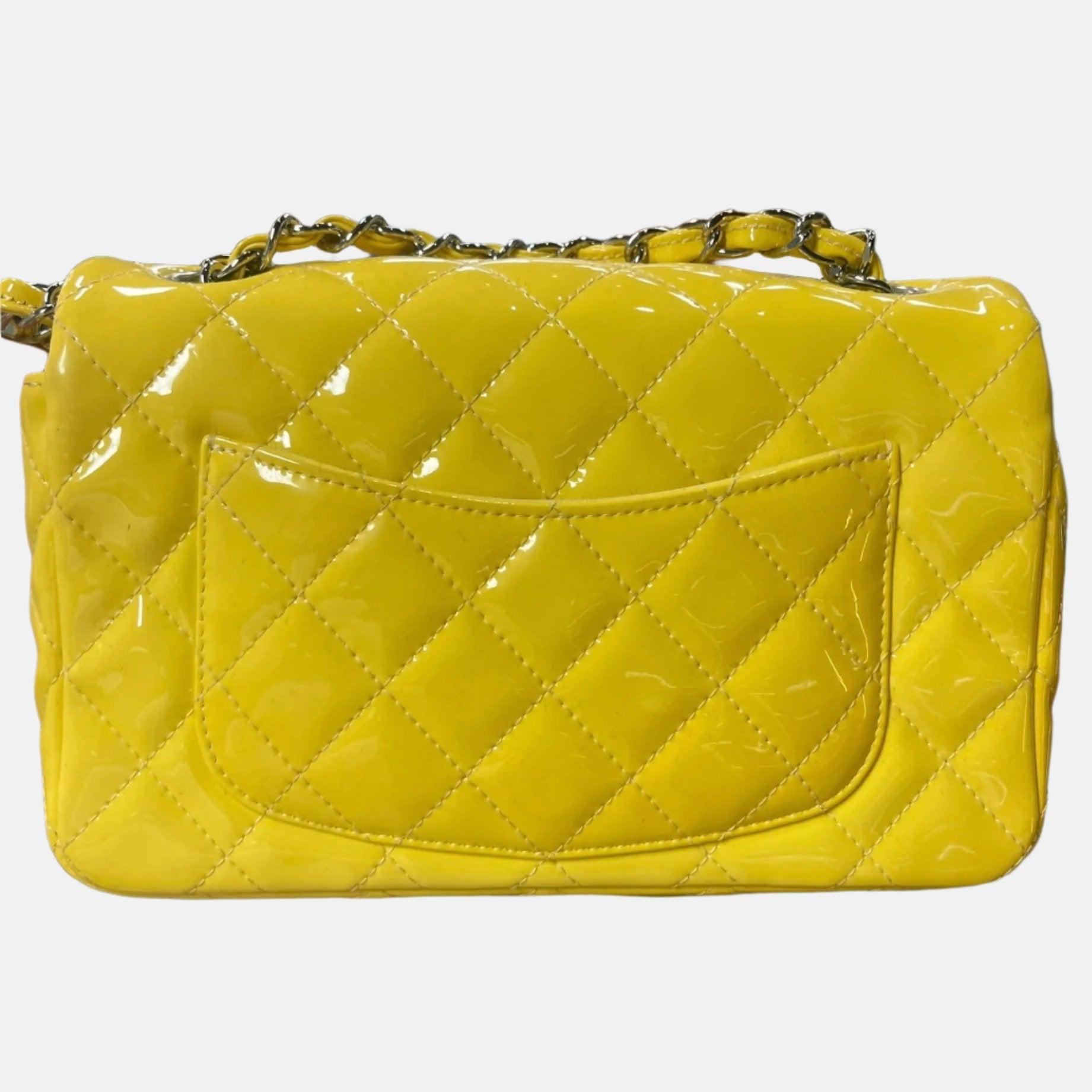 Chanel Classic Flap Rectangular Mini Yellow Patent Leather Silver HW, 2014-2015
  These are professional photos of the actual bag offered by Luxbags.
  Add a touch of brightness to your summer wardrobe with this classic flap from Chanel, featuring a