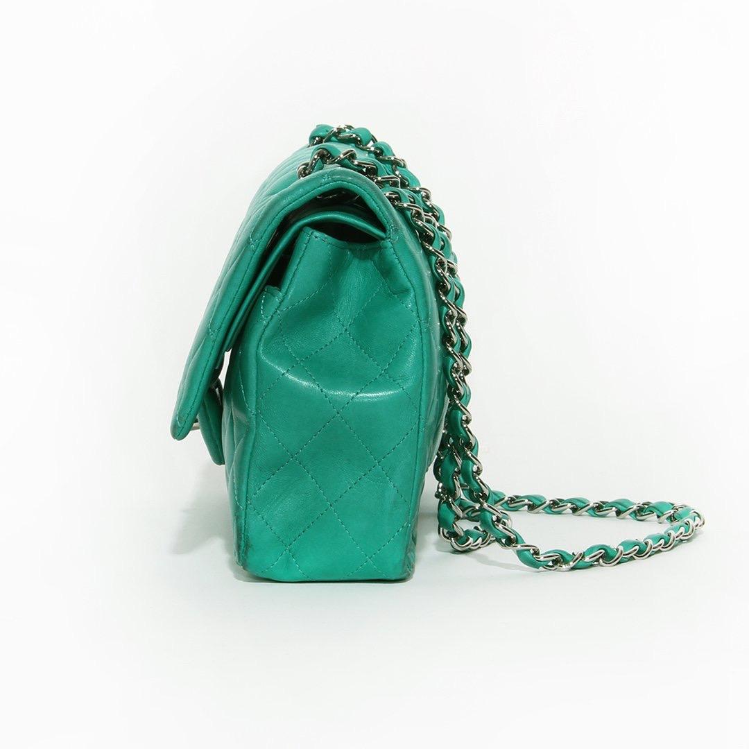 Classic flap sea foam green handbag by Chanel
2012
Green quilted lambskin
Silver-tone hardware
Top flap turn-lock closure 
Double flap 
Chain shoulder strap with woven leather
Leather interior 
Three interior slip pockets
Back slip pocket
Chanel CC