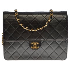 Chanel Classic Flap shoulder bag in black quilted lambskin and gold hardware