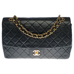 Chanel Classic Flap shoulder bag in black quilted lambskin and gold hardware