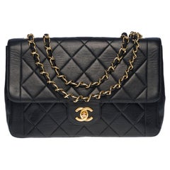 Chanel Classic Flap shoulder bag in black quilted lambskin and gold hardware