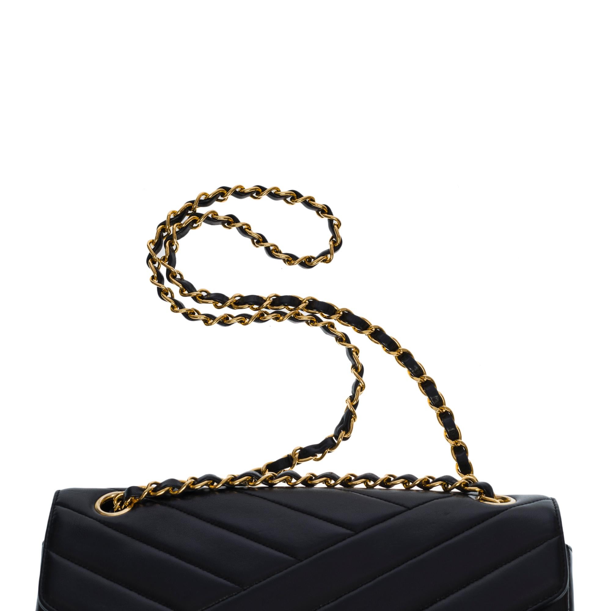 Chanel Classic Flap shoulder bag in black quilted leather with herringbone , GHW 1