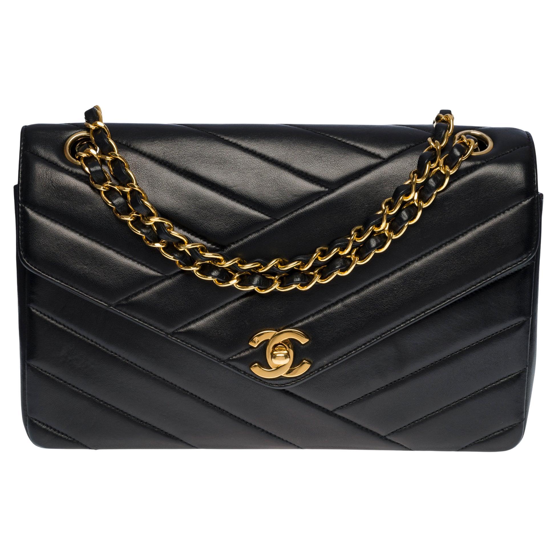 Chanel Classic Flap shoulder bag in black quilted leather with herringbone , GHW