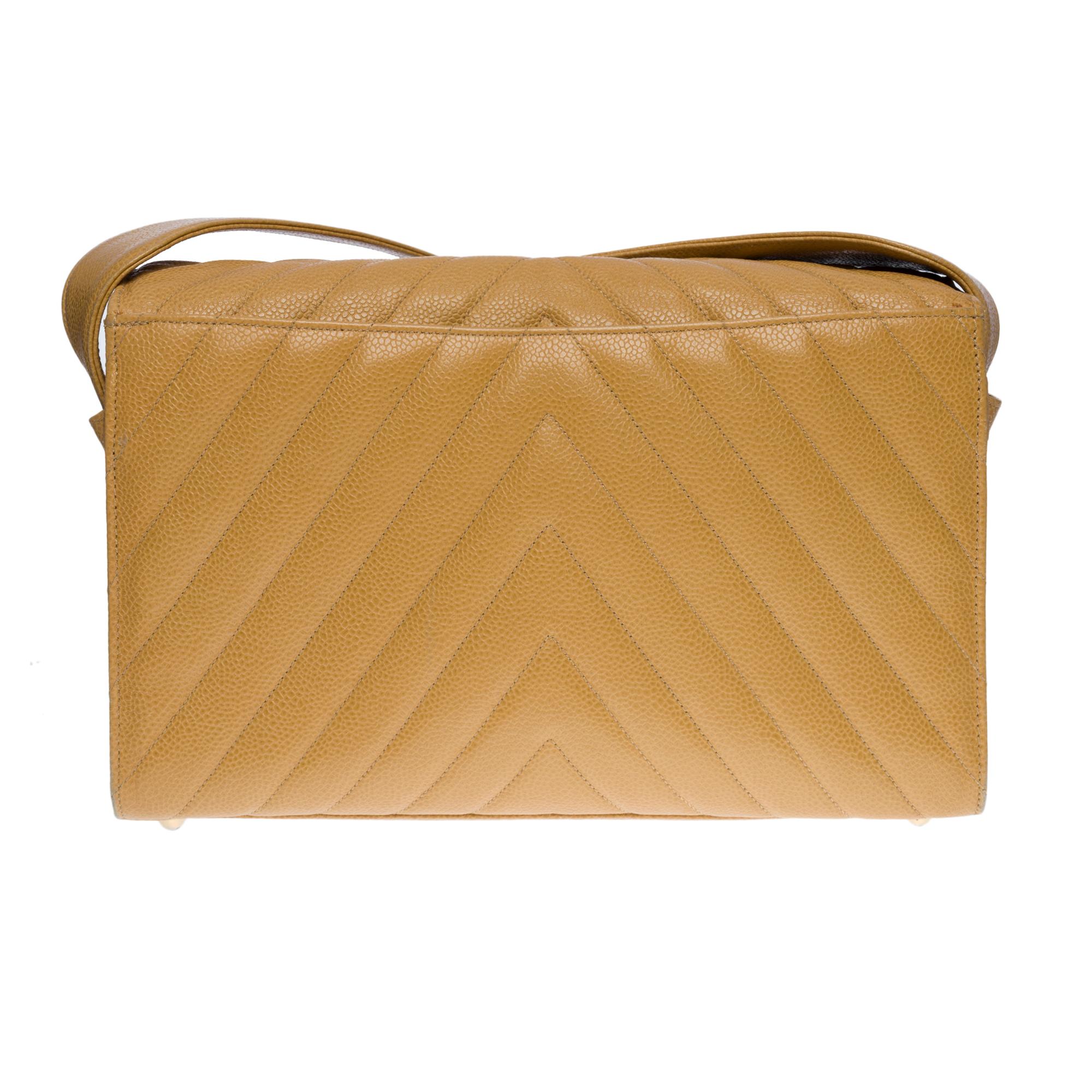 Gorgeous Chanel Flap bag with herringbone pattern in golden beige caviar leather, cream colored stitching, gold-tone metal hardware, golden beige caviar leather handle for a shoulder support
Backpack pocket  
Flap closure, magnetic clasp with gold