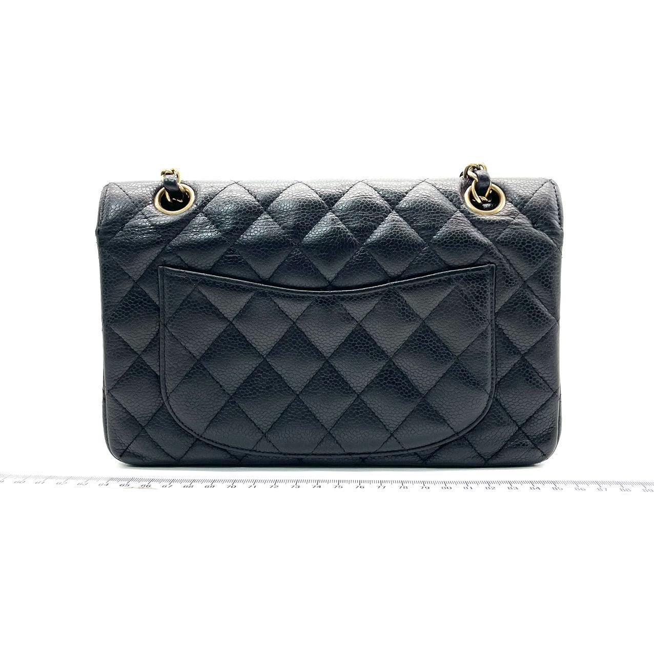 Chanel Classic Flap Small Black Caviar Leather with 24k Gold Hardware, 2004-2005
These are professional photos of the actual bag.
  
  This one-of-a-kind Chanel Classic Flap Vintage bag exudes sophistication and timeless elegance. Crafted from black