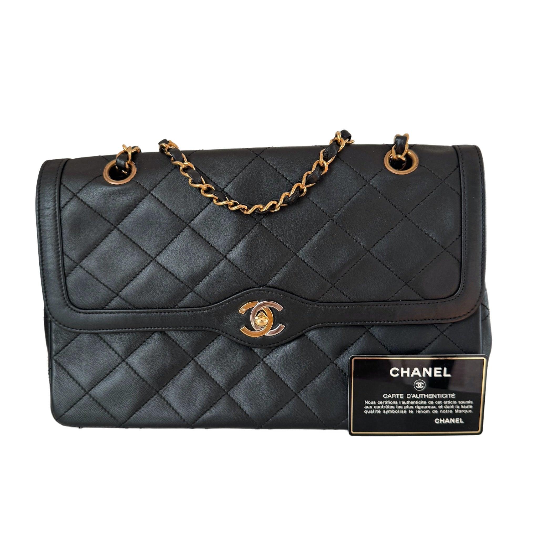 Chanel Classic Flap Vintage Black Lambskin Leather with Bi-color Hardware
 These are professional photos of the actual bag.
 CONDITION: GOOD 
 This preloved /preowned vintage Chanel handbag has been professionally touched up around the corners, flap