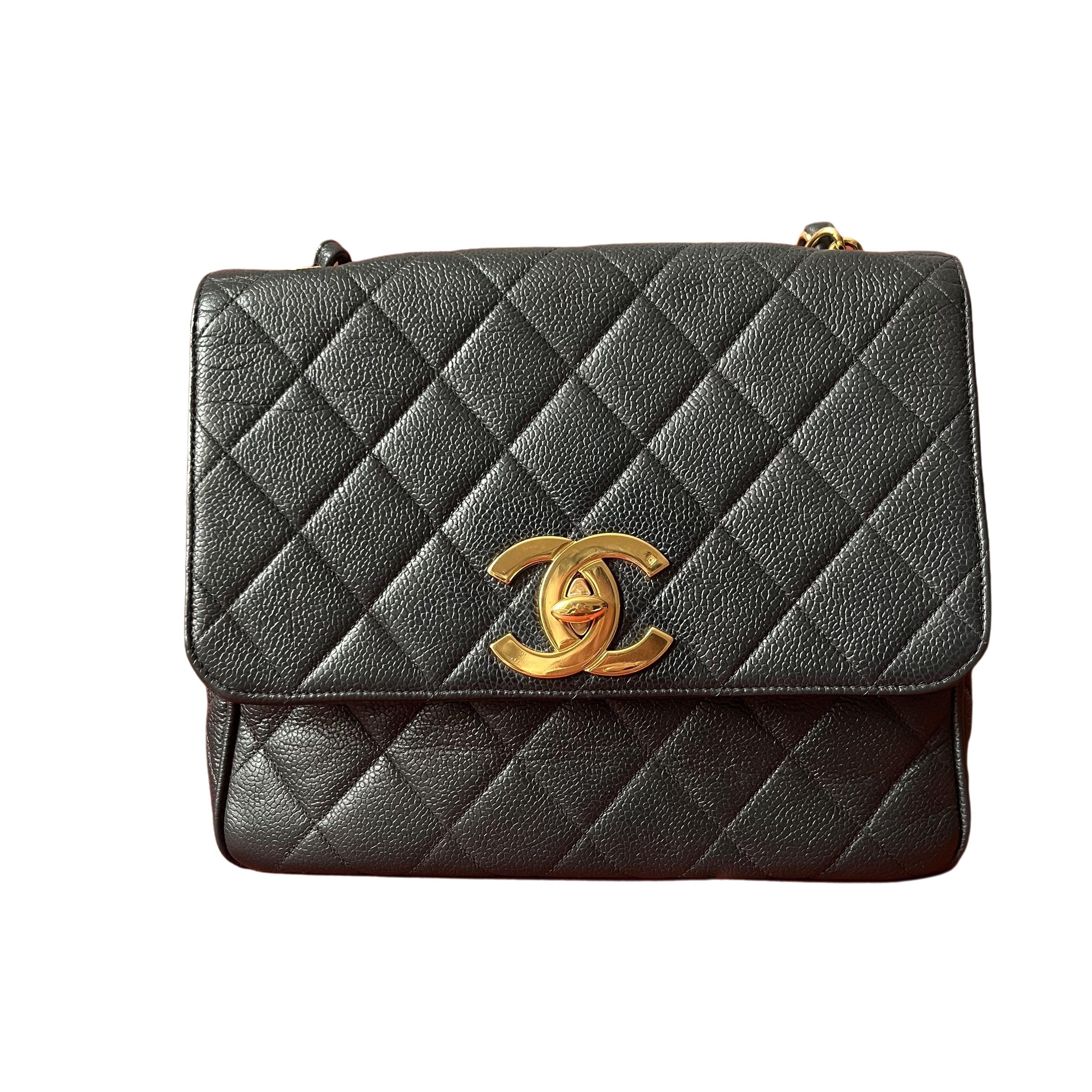 Chanel Classic Flap Vintage Black Caviar Leather 24k Gold Plated Giant CC Logo, 1994-96
 These are professional photos of the actual bag .
 Experience timeless elegance with the Chanel Vintage Classic Flap Square Shoulder Bag. Crafted with luxurious