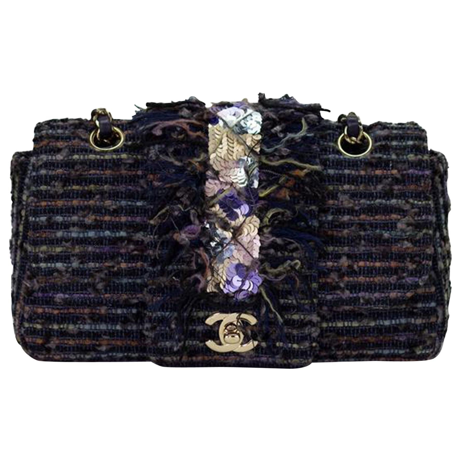 Chanel Vintage Rare Tweed Jeweled Sequin Mermaid Fringe Classic Flap Bag

2005 {VINTAGE 19 Years}
Small sized flap with mermaid colored sequins and classic interlocking clasp
Silver hardware
Interwoven chain
Small CC logo
Interior black lambskin