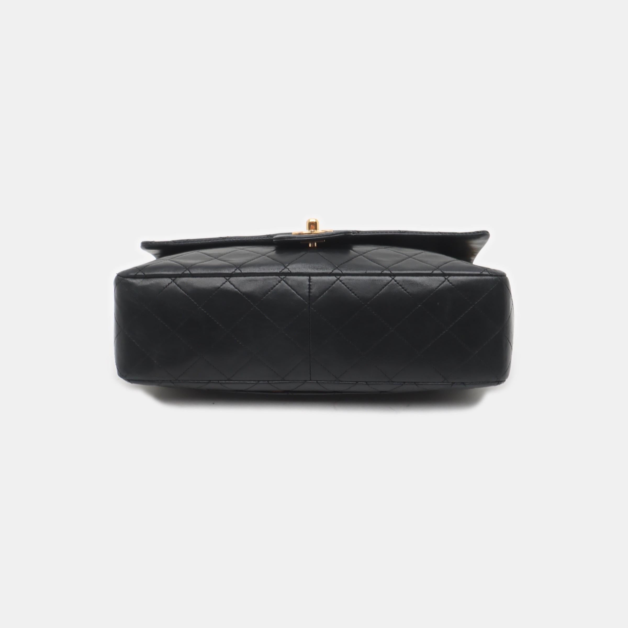This one-of-a-kind Chanel Classic Flap Vintage bag exudes sophistication and timeless elegance. Crafted from luxurious black lambskin leather, it is adorned with 24k gold hardware. Made in between 1996-1997, this bag dates almost 30 years, remaining