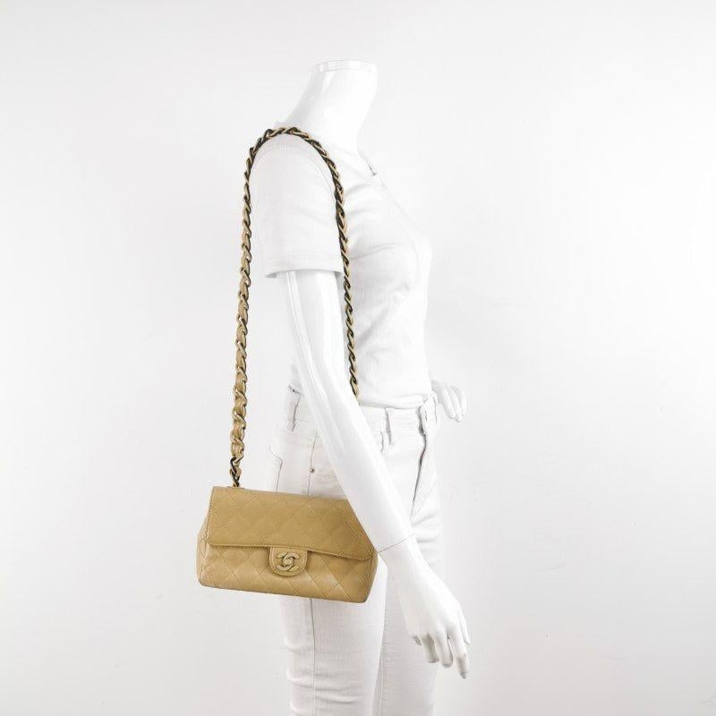 Chanel Classic Flap Vintage Mini Beige Calfskin Bi-color Acrylic Strap Crossbody Bag, 2000-2002
 These are professional photos of the actual bag.
 Add a touch of brightness to your summer wardrobe with this classic flap from Chanel, featuring a
