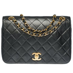 Chanel Classic Full Flap shoulder bag in black quilted leather and gold hardware