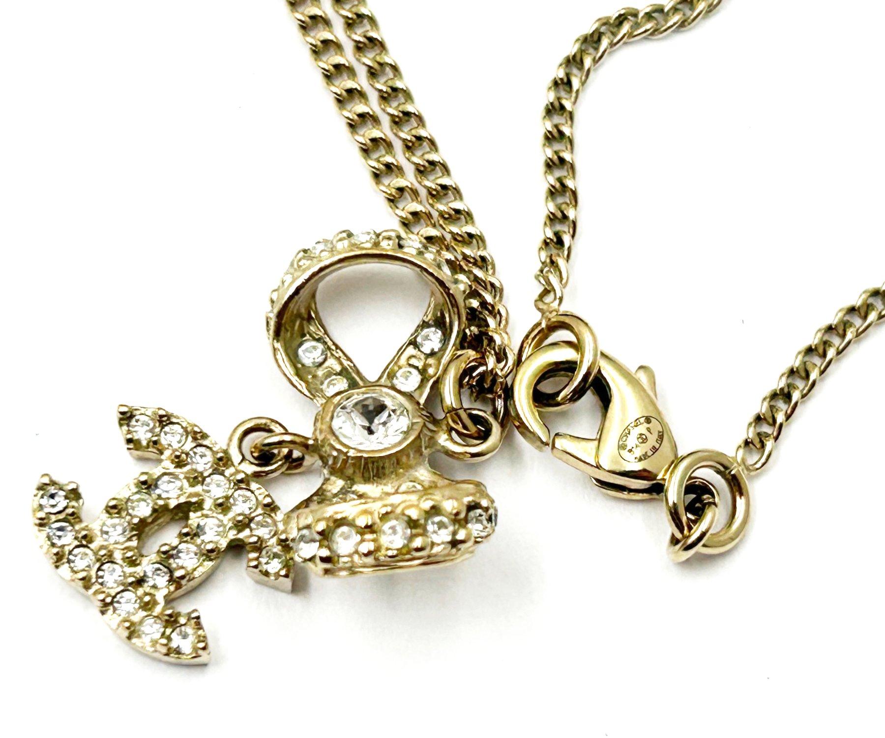 Chanel Classic Gold Ribbon Bow CC Crystal Pendant Necklace  In Excellent Condition For Sale In Pasadena, CA