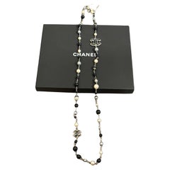 Chanel Classic Long Elegant Black and White Pearl Glass CC Necklace