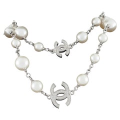 Chanel Classic Long Pearl Necklace with 5 CC Silver Crystal Logos