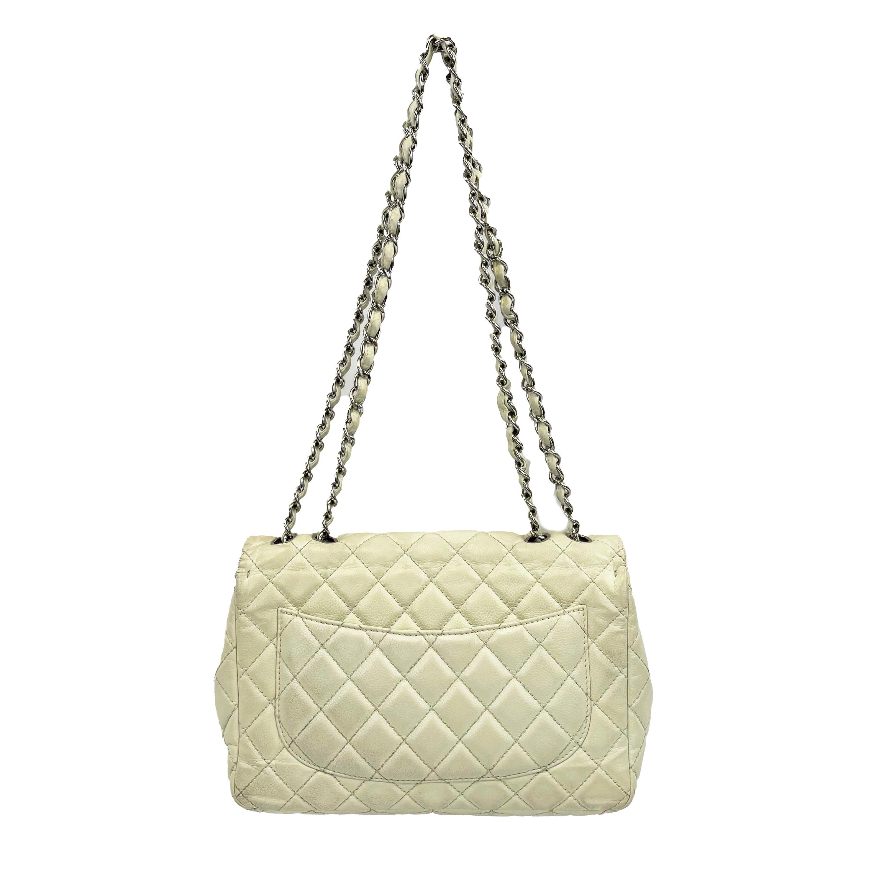 CHANEL - Classic Maxi CC Ecru Single Flap Shoulder Bag
Measurements

Width: 12 in / 30.48 cm
Height: 7.5 in / 19.05 cm
Depth: 3.25 in / 8.255 cm
Strap Drop: 25 in / 63.5 cm
Handle Drop: 13.5 in / 34.29 cm
Details

Made In: Italy
Color: