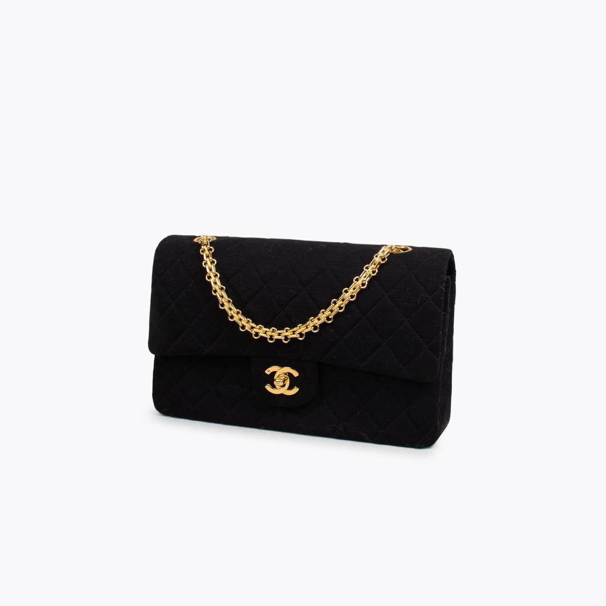 Black Chanel Classic Medium Jersey Double Flap Bag

– Gold-tone hardware
– Interlocking CC logo & quilted pattern
– Chain-link shoulder straps
– Single exterior pocket
– Burgundy leather lining & dual interior pockets and turn-lock closure at
