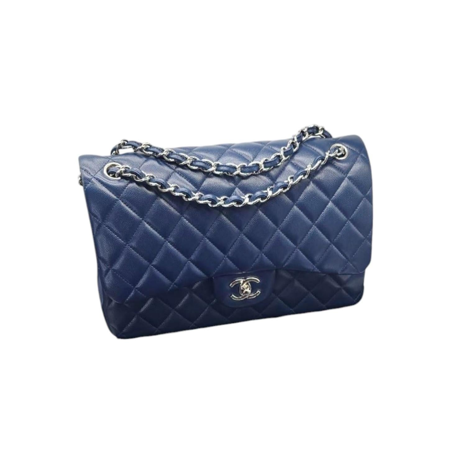 This Chanel Caviar Quilted Jumbo Double Flap is crafted of fine diamond-quilted cobalt blue caviar leather. The bag features leather threaded silver-tone chain shoulder straps, an interior flap, and a facing half flap with a silver-tone Chanel CC