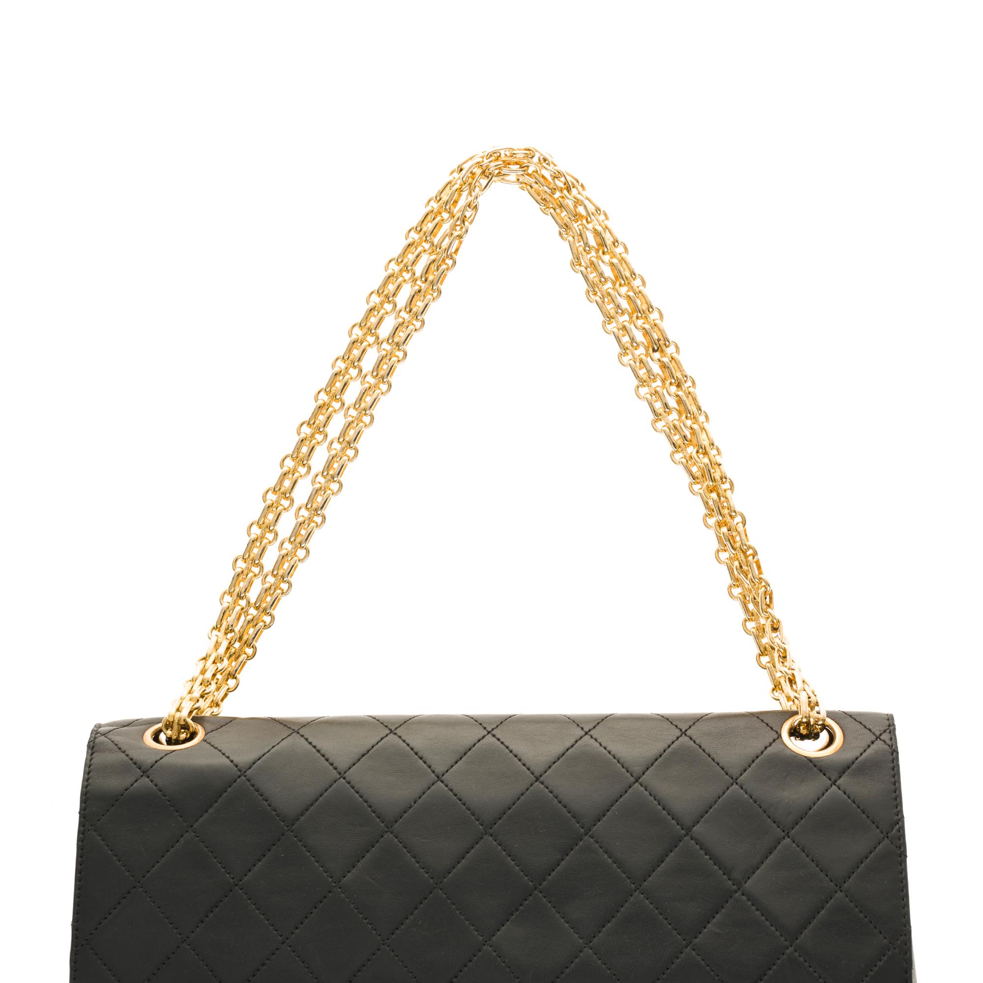 Chanel Classic shoulder bag in black quilted lambskin and gold hardware 2
