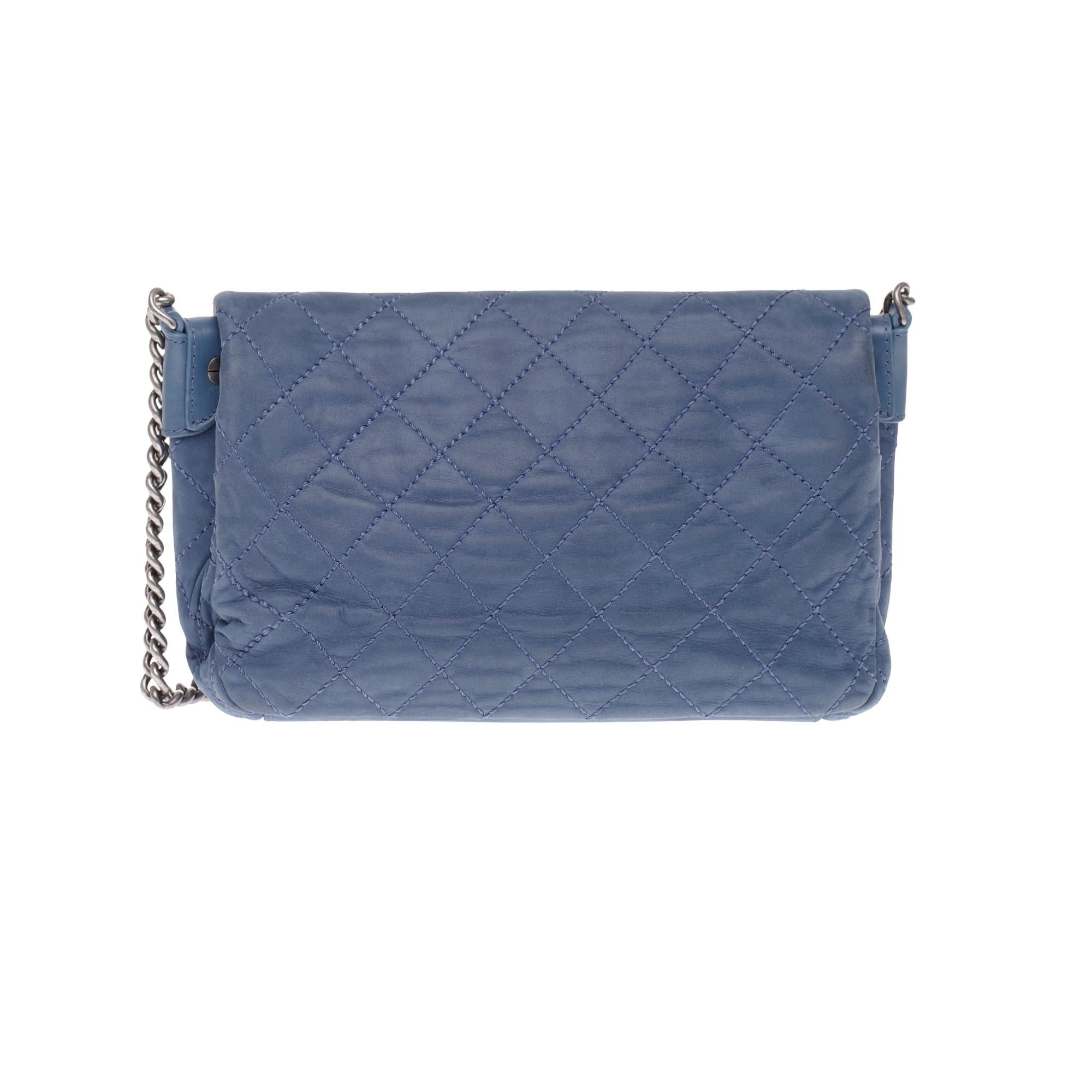 Lovely Chanel Classic Blue Coated Leather Handbag, Antique Silver Metal Shoulder Chain
for shoulder or crossbody support.
Flap closure -- magnetic DC clasp.
Grey canvas interior with 2 bellows
Signature: 