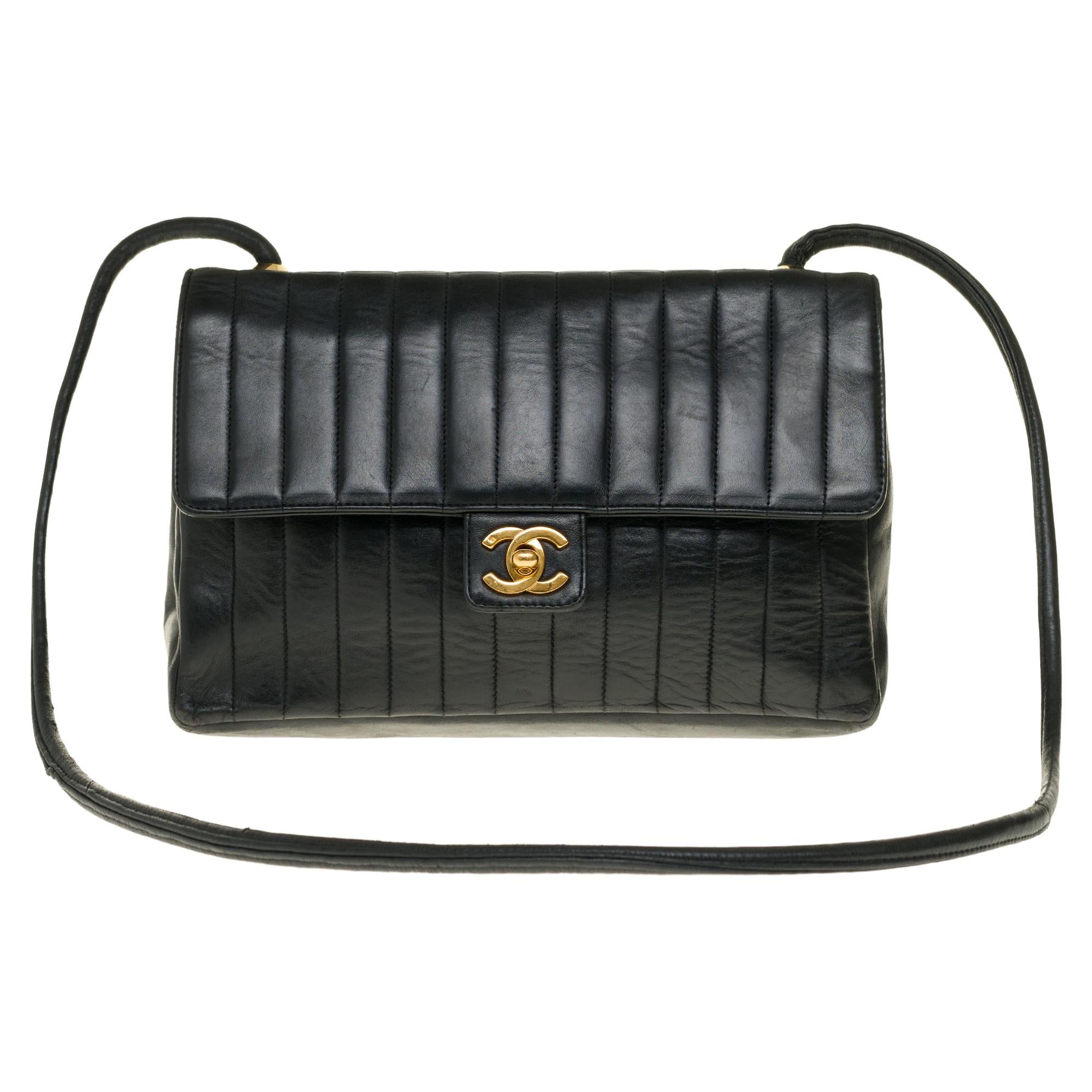Chanel Classic shoulder bag in chevron black quilted lambskin with gold hardware