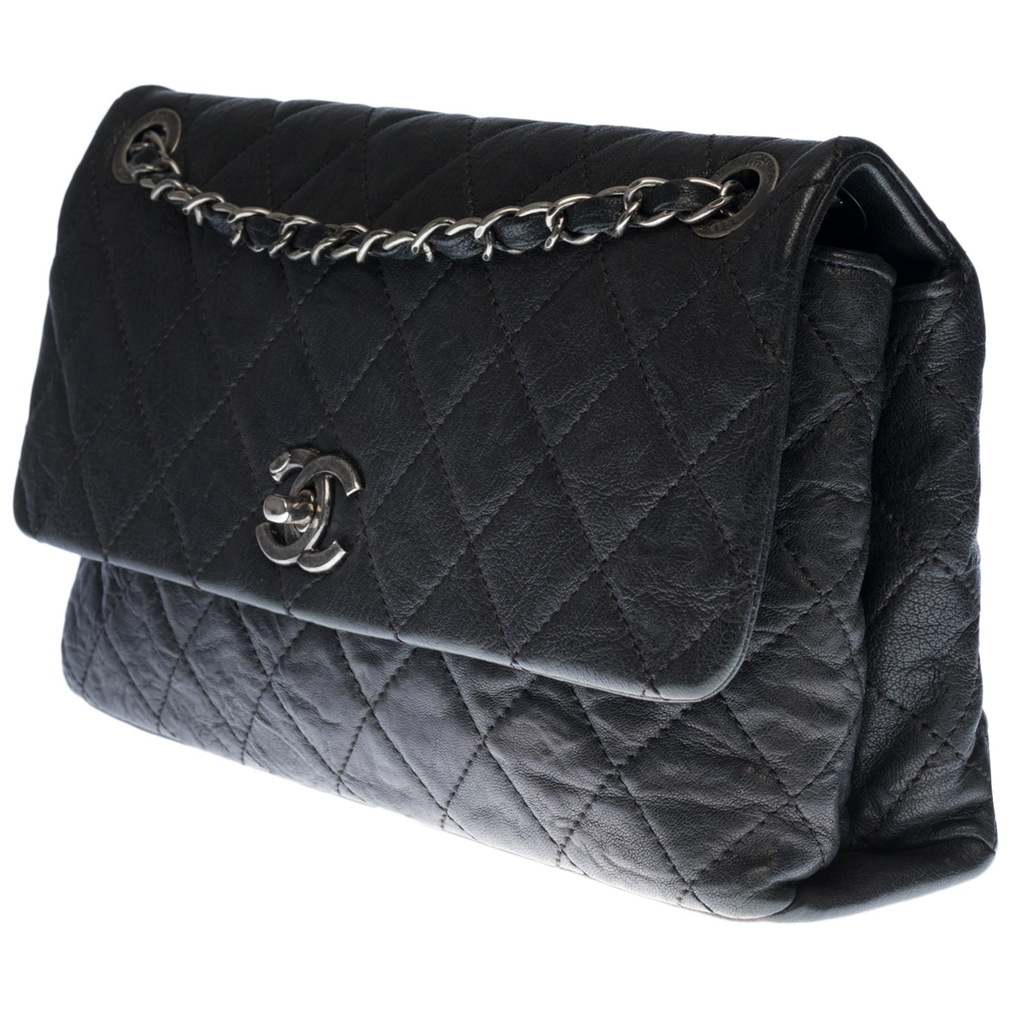 Black Chanel Classic shoulder Flap bag in black quilted leather and silver hardware