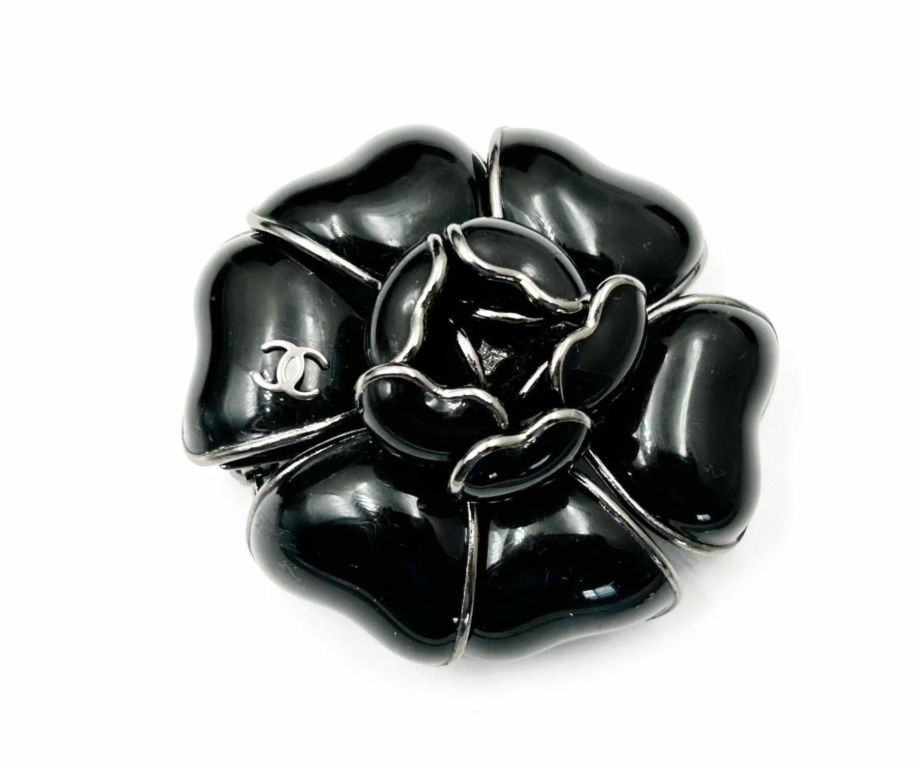 Chanel Silver CC Black Camellia Brooch

* Marked 03
* Made in France
*Comes with original box

-It is approximately 2.25