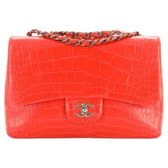 A SHINY RED ALLIGATOR JUMBO CLASSIC DOUBLE FLAP WITH GOLD HARDWARE