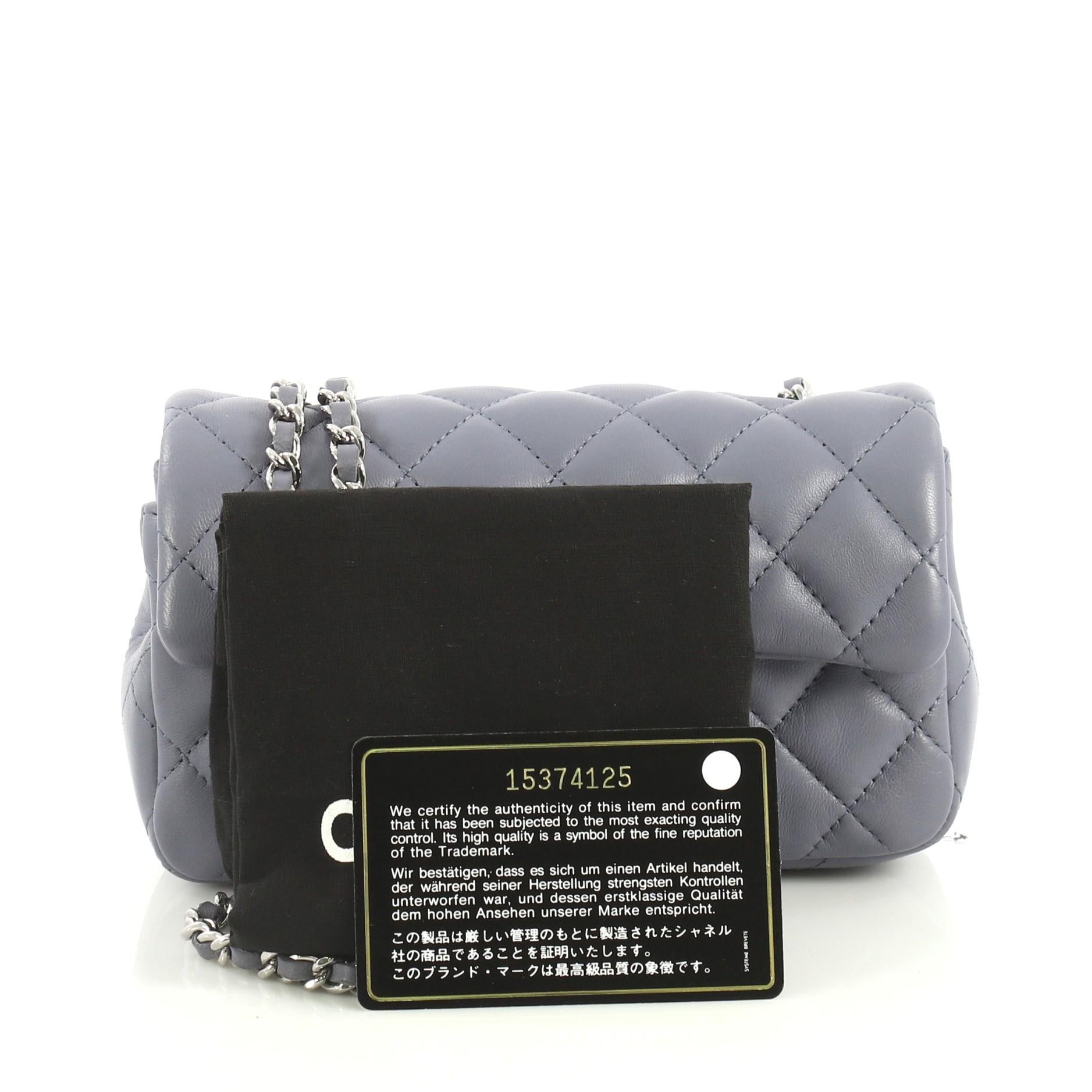 This Chanel Classic Single Flap Bag Quilted Lambskin Extra Mini, crafted in blue quilted lambskin leather, features woven-in leather chain link strap and silver-tone hardware. Its CC turn-lock closure opens to a blue leather interior with slip
