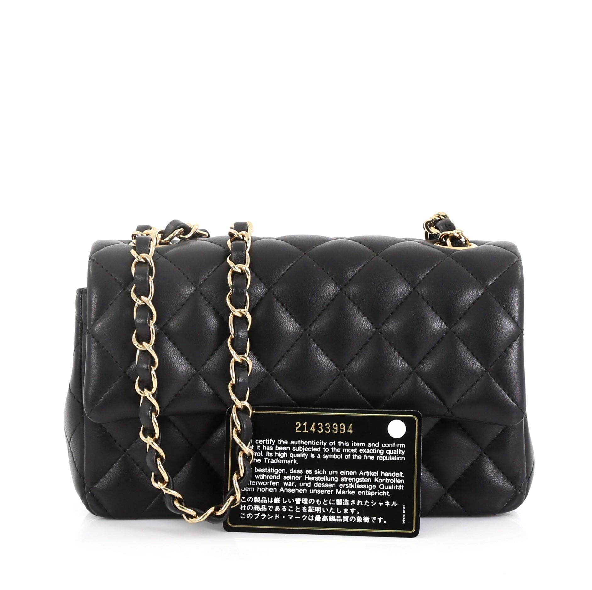 This Chanel Classic Single Flap Bag Quilted Lambskin Mini, crafted in black quilted lambskin, features woven-in leather chain link strap, exterior back slip pocket, and gold-tone hardware. Its CC turn-lock closure opens to a black leather interior