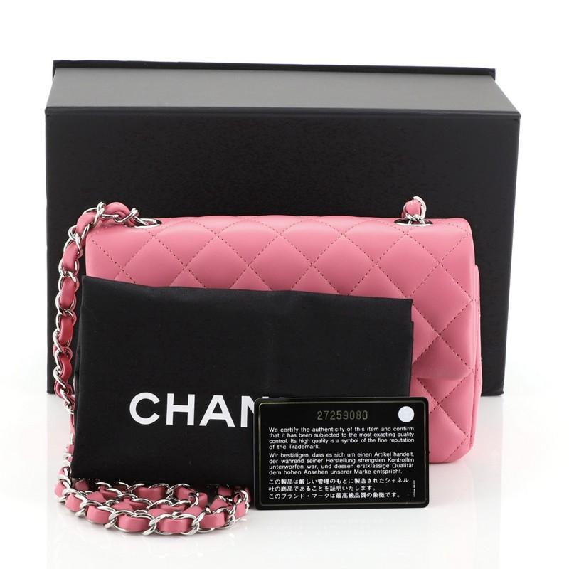 This Chanel Classic Single Flap Bag Quilted Lambskin Mini, crafted in pink quilted lambskin leather, features woven-in leather chain link strap, exterior back slip pocket, and silver-tone hardware. Its CC turn-lock closure opens to a pink leather
