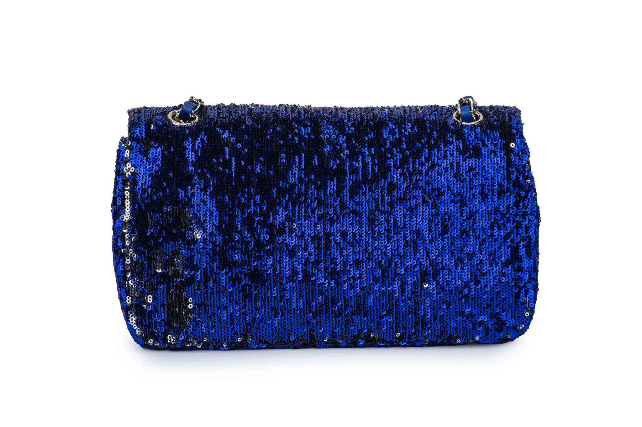 Chanel Classic Single Flap Bag made of sequins in blue and black. The hardware is silver and the chain has a drop of 9”/17”. Collection #17, 2012/2013. The bag is in excellent condition and comes with the original dustcover, the hologram and the ID