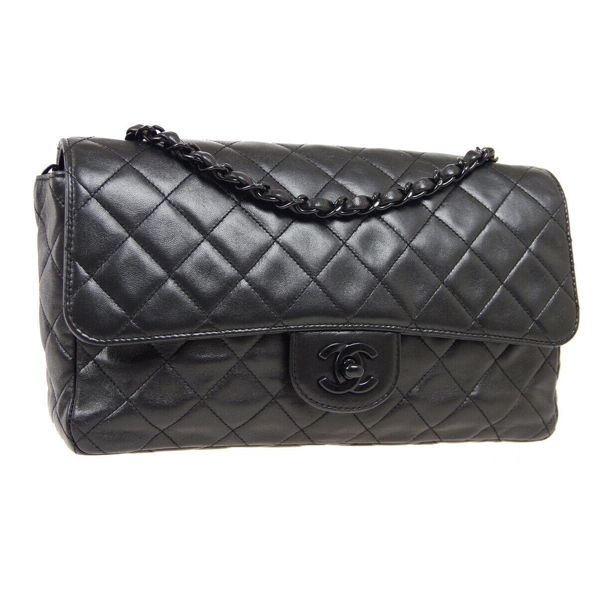 This iconic Chanel bag is crafted from quilted black lambskin and features a single flap. It also features the classic CC logo twist lock on the front flap. The black chain winded with leather can easily be carried as a shoulder bag with a double or