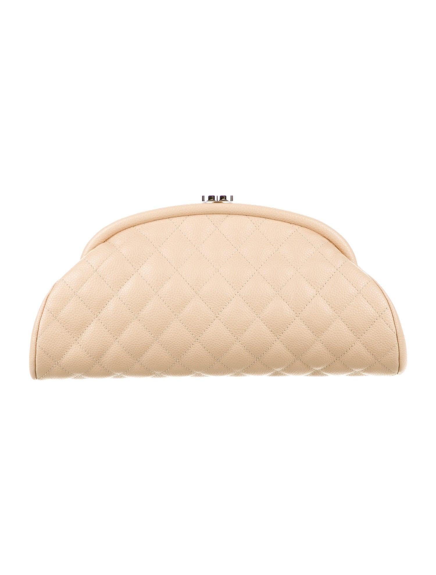 Chanel Classic Vintage Beige CC Diamond Quilted Caviar Timeless Clutch

This stylish clutch is beautifully crafted of beige diamond quilted caviar leather. The clutch features a polished silver kiss lock in the form of a Chanel CC logo that opens to