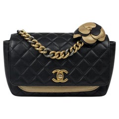 CHANEL, Classique Camélia in black leather 