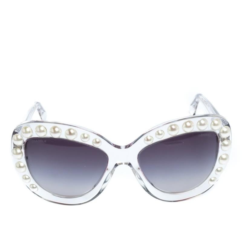 This pair of sunglasses from Chanel is in tune with the high-end, effortless style the brand is known for. The gradient lenses come enclosed in a cat-eye frame embellished with faux pearls and held by temples featuring the brand's