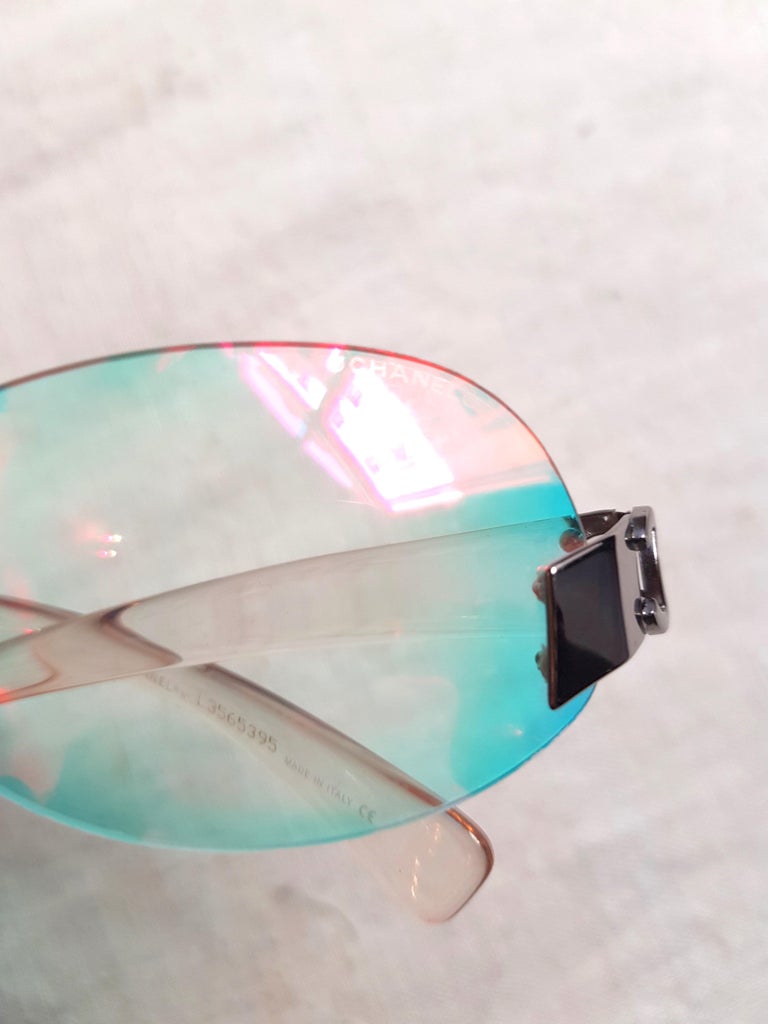 CHANEL clear holographic multi color tinted CC silver rimless Sunglasses