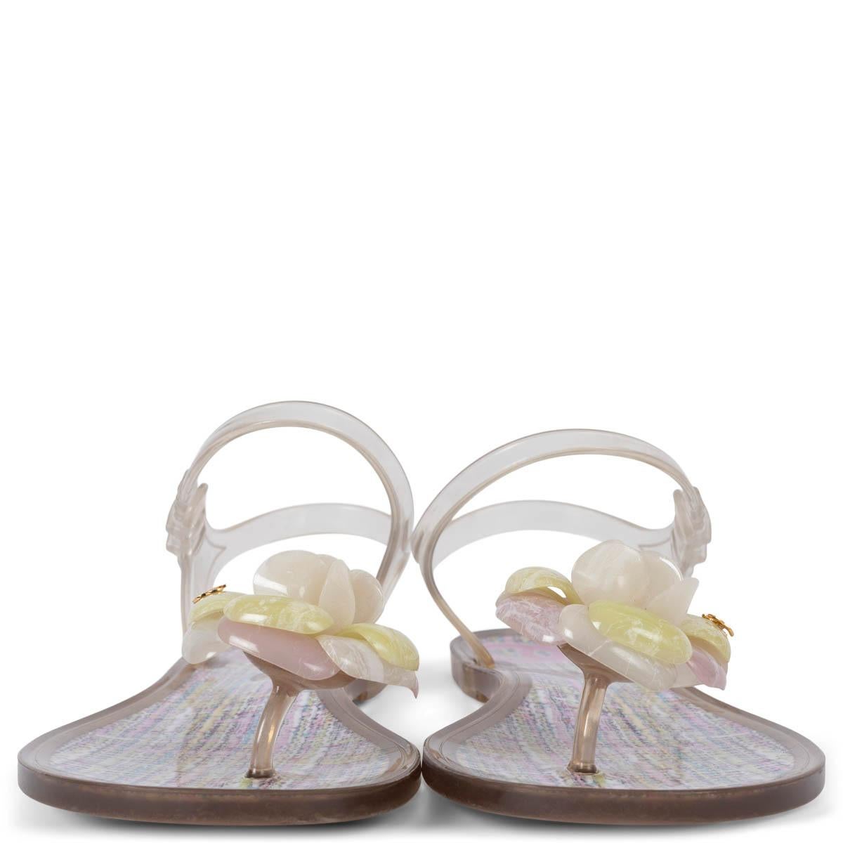 100% authentic Chanel Camellia thong sandals in clear, lila, lime green and white rubber. Have been worn and are in excellent condition. 

Measurements
Model	13C G28878 Y15053
Imprinted Size	38
Shoe Size	38
Inside Sole	25cm (9.8in)
Width	8.5cm