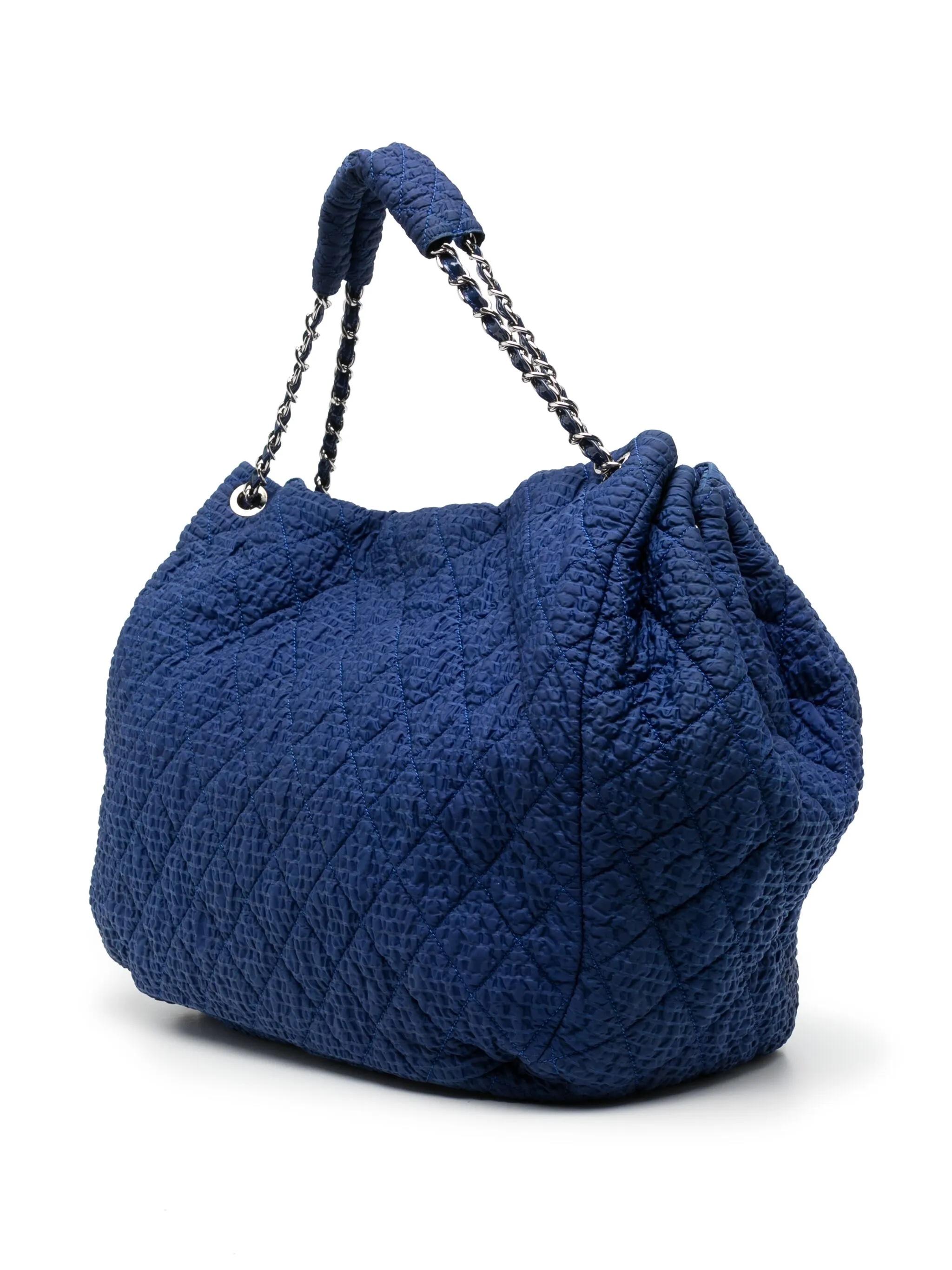 - Cobalt blue
- Nylon
- Silver-tone hardware
- Logo patch to the front
- Main compartment
- Flap with magnetic closure
- Internal zip fastening pocket
- Two interior flat pockets
- Condition: Excellent
This pre-loved bag is in excellent condition