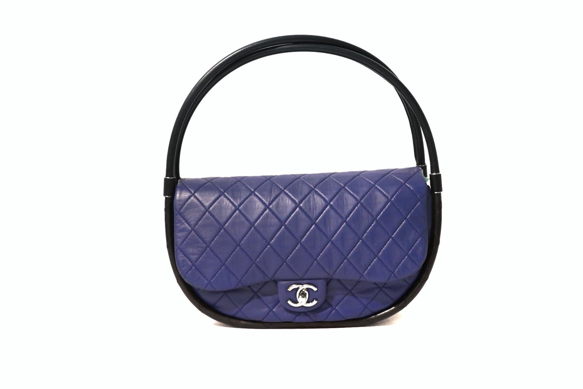 This authentic Chanel Cobalt Blue Leather Hula Hoop Bag is in pristine condition.  From the Spring 2013 collection, the Hula Hoop was originally planned to be a runway piece only.  
Bold cobalt blue leather is quilted in signature Chanel diamond