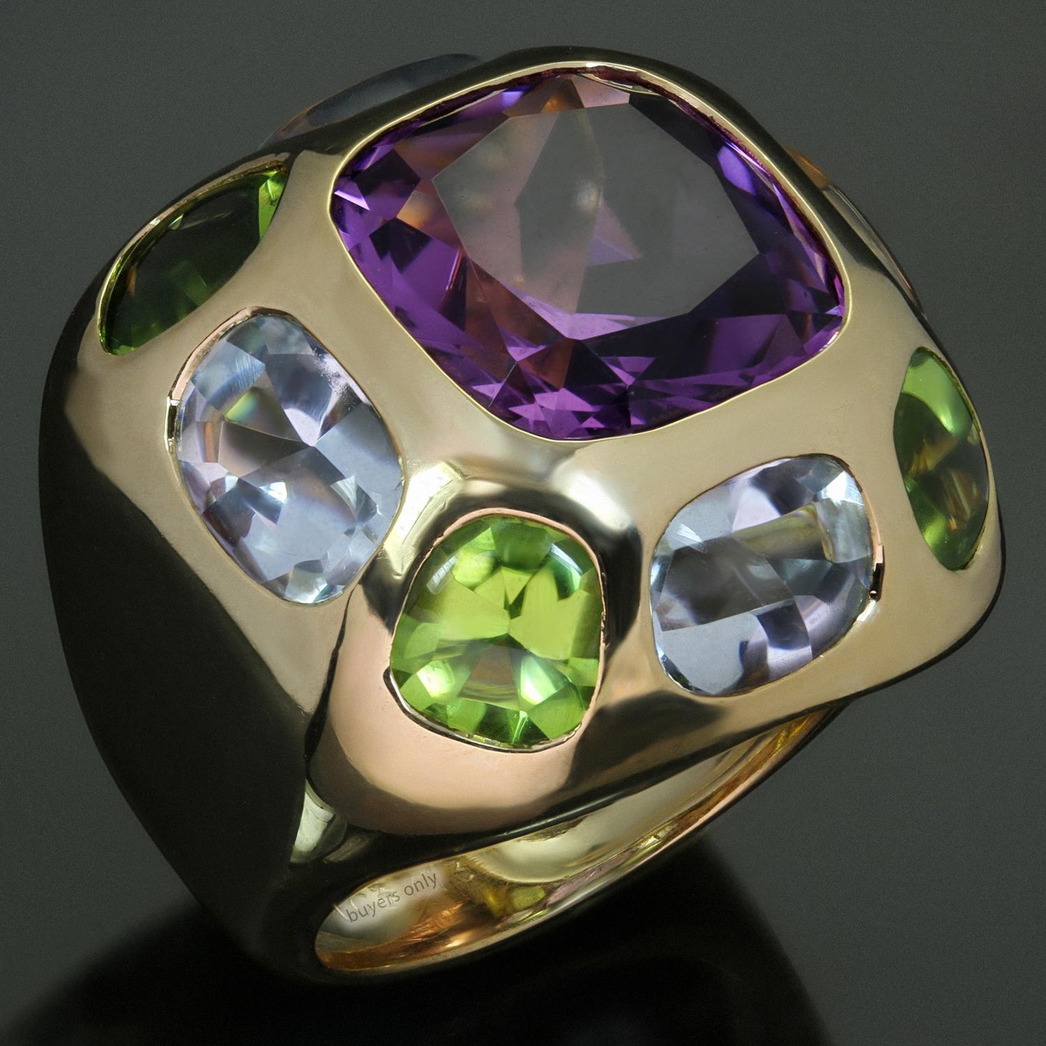 This stunning Chanel cocktail dome band ring from the Coco collection is crafted in 18k yellow gold and features a faceted amethyst in the center surrounded by 4 cabochon peridots and 4 cabochon oval aquamarines. The estimated weight of the